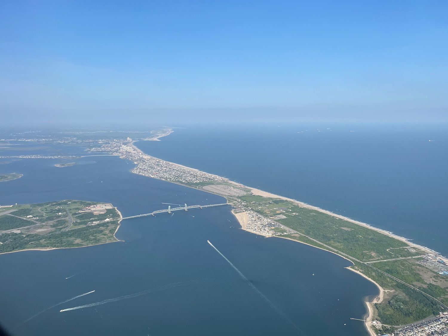 an aerial view of a body of water and a city