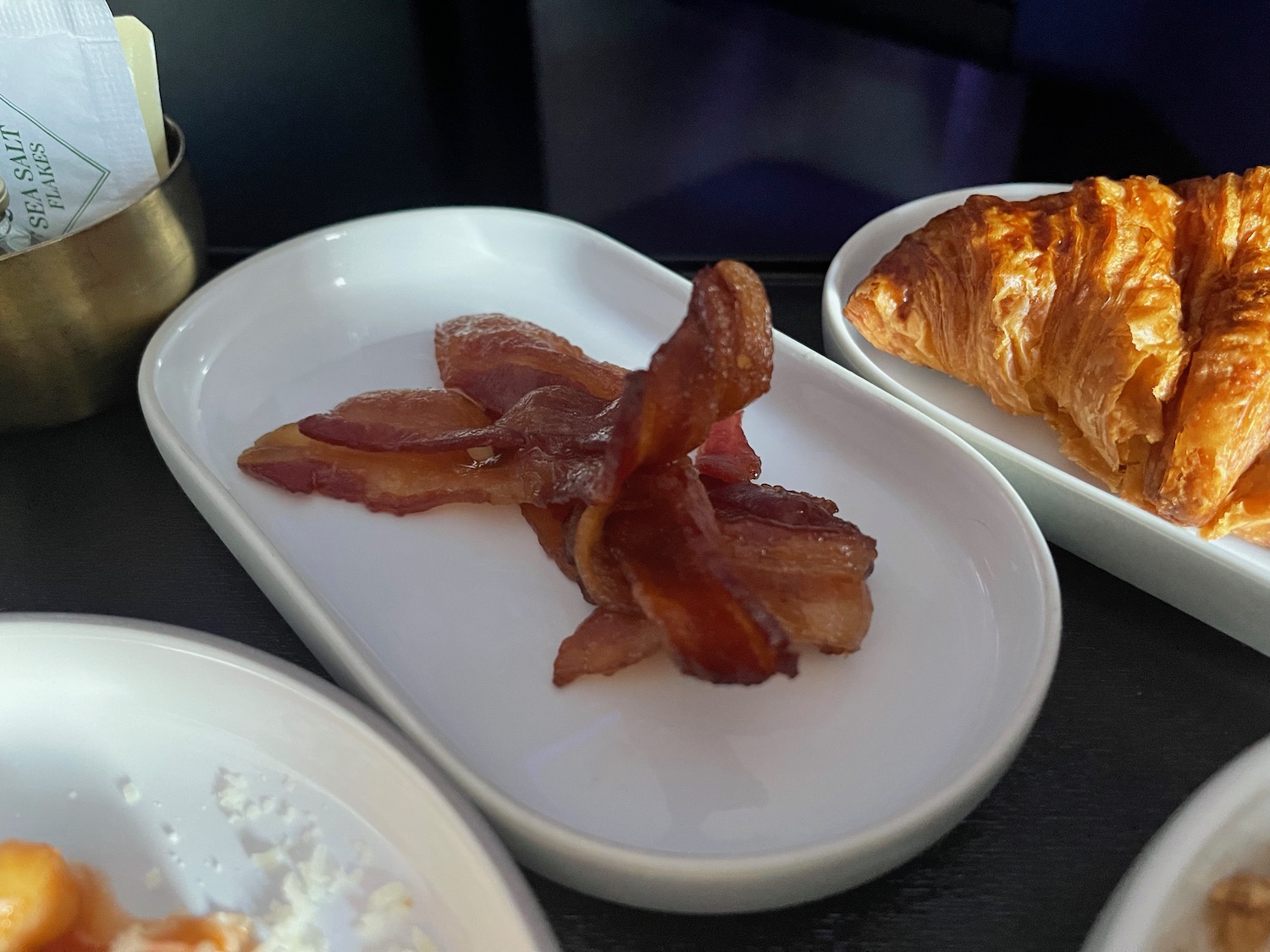 a plate of bacon on a table