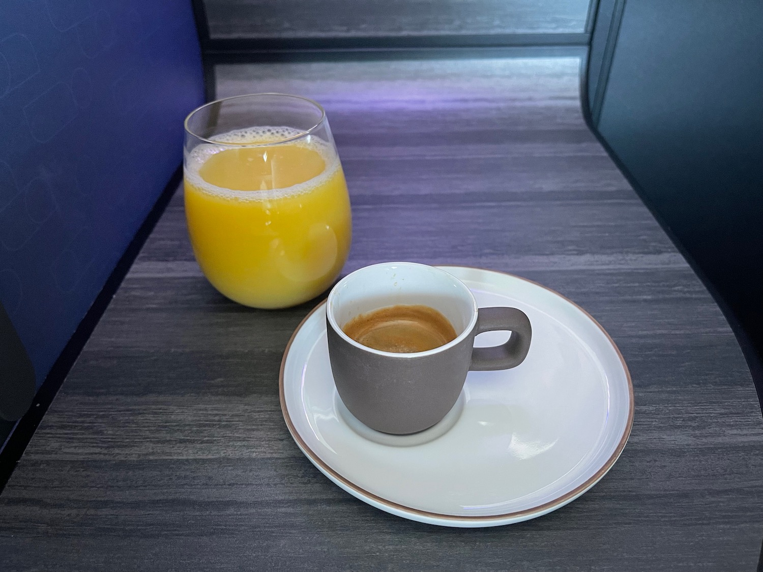 a cup of coffee and a glass of orange juice