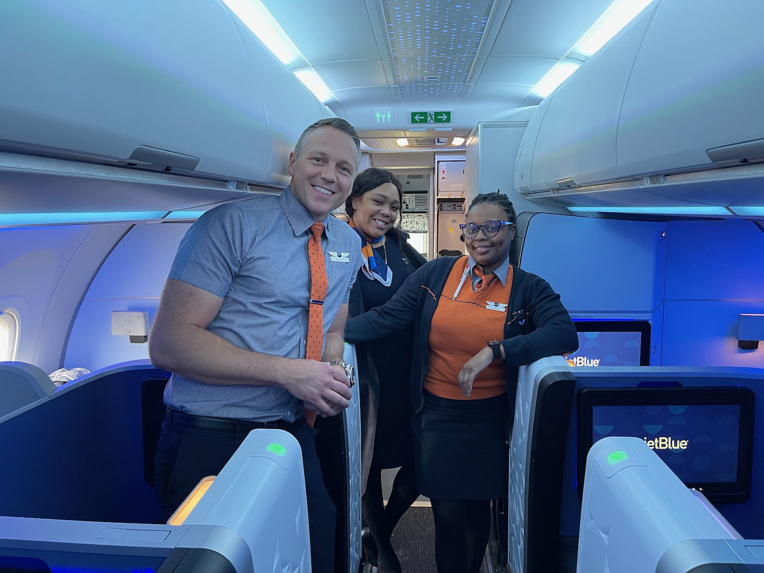 a group of people standing in an airplane