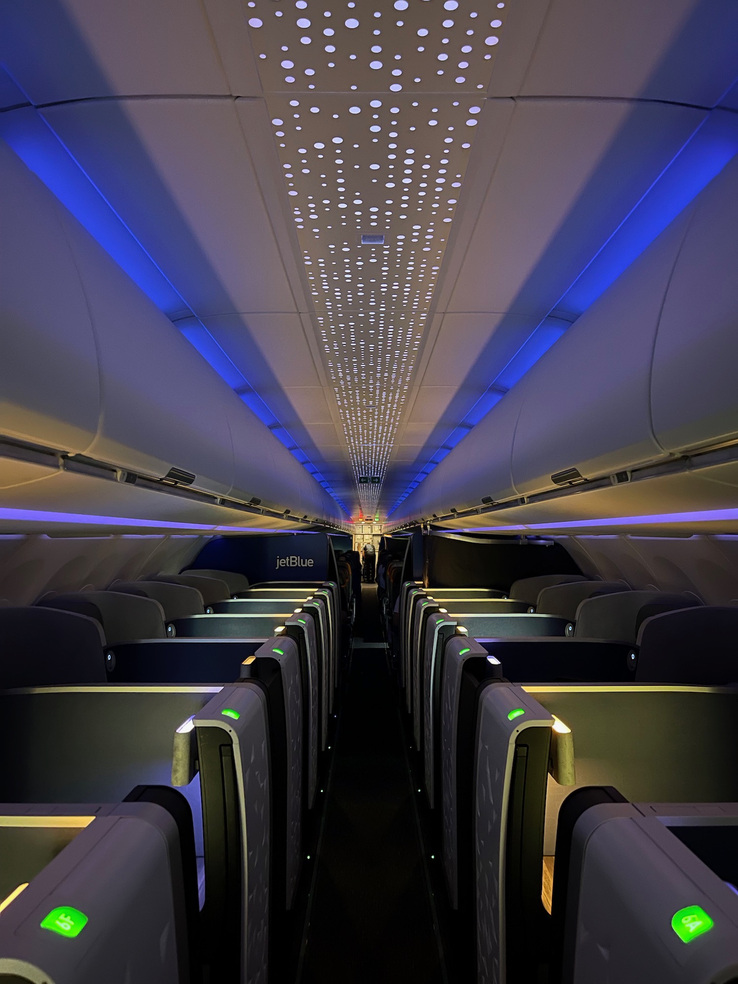 inside an airplane with rows of seats