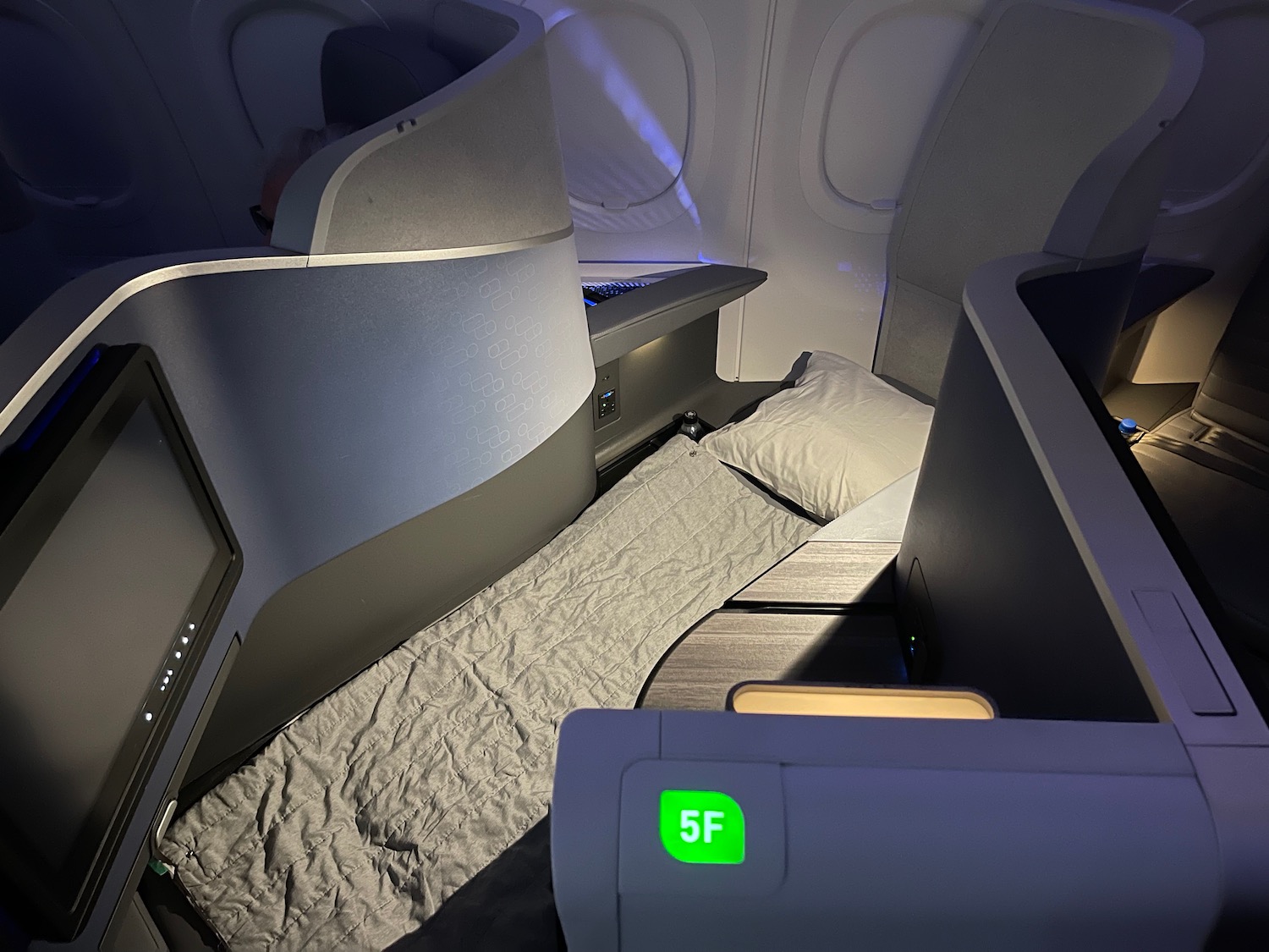 a bed and a chair in a plane