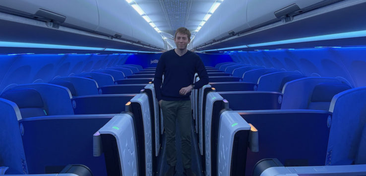 a man standing in an airplane