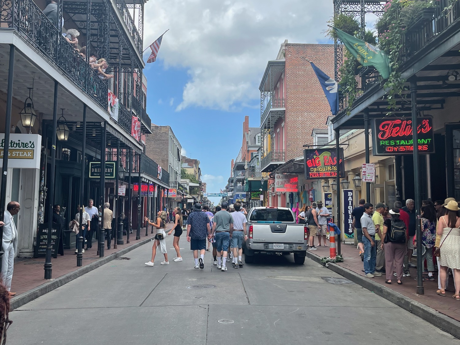 a group of people walking down a street