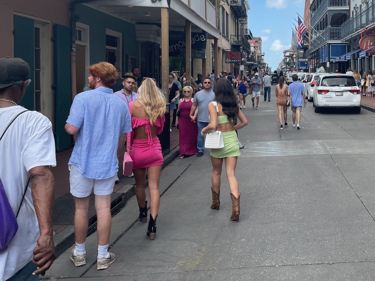 a group of people walking down a street