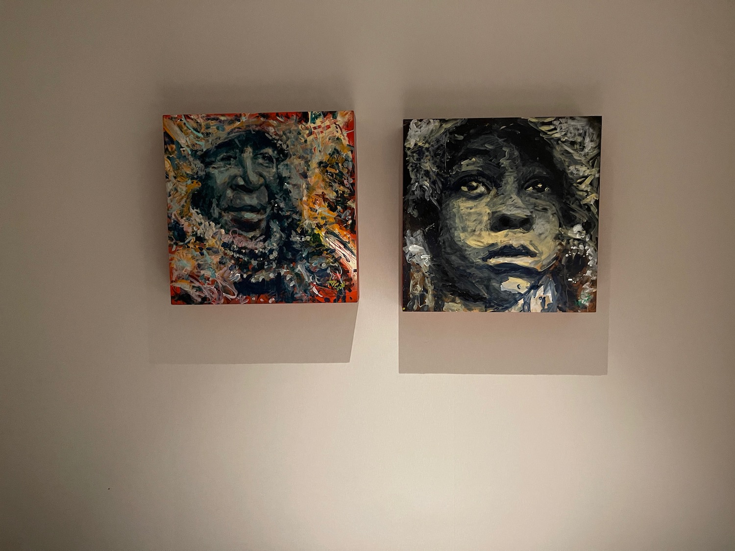 two paintings on a wall