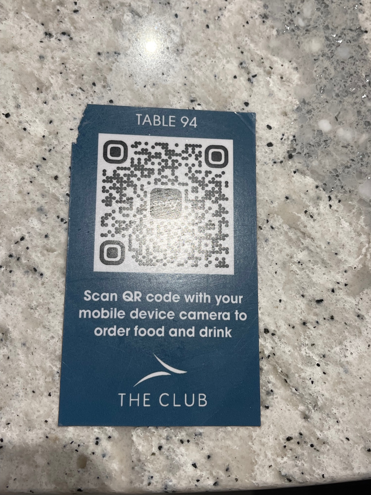 a blue card with a qr code on it