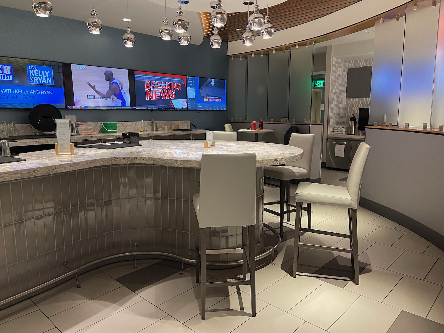 a bar with chairs and a table