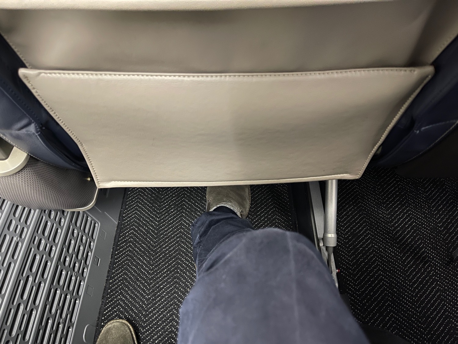 a person's legs in a seat