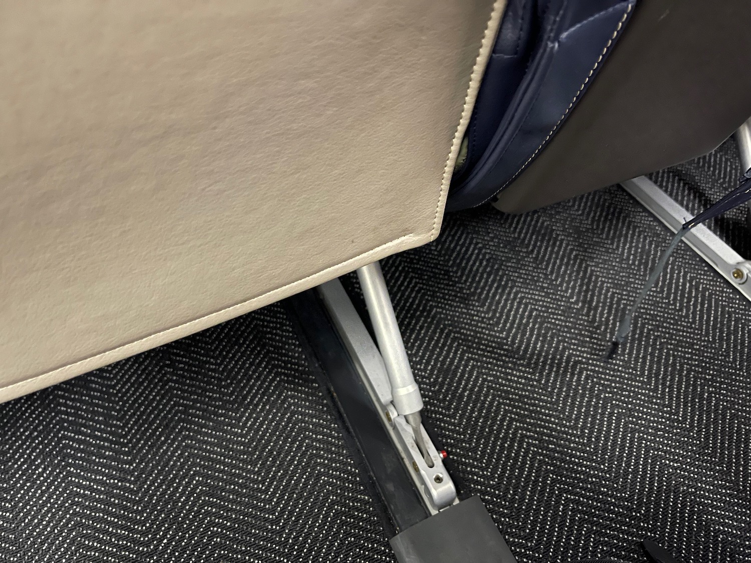 a seat with a metal lever