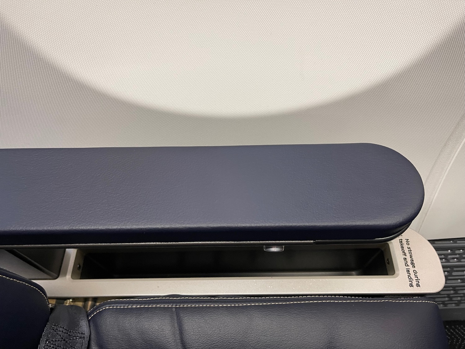 a arm rest with a black leather cover