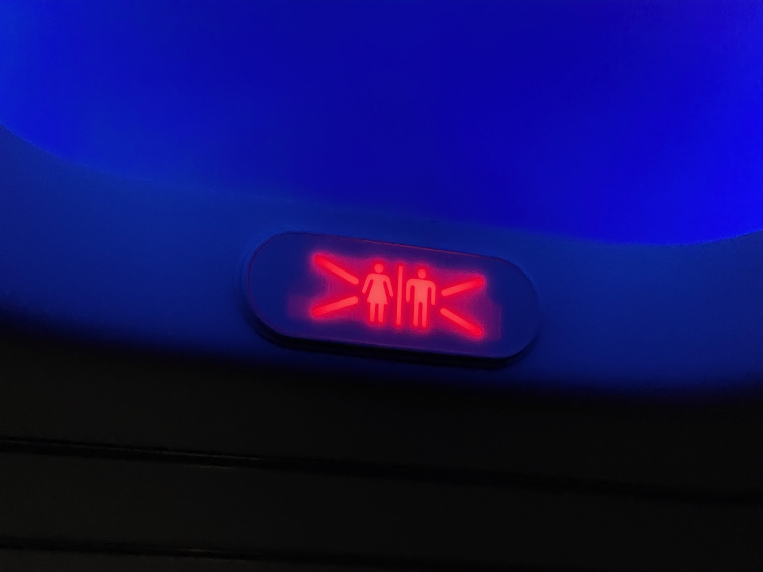 a red light on a blue surface