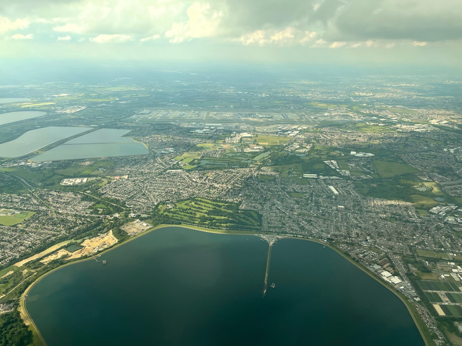 an aerial view of a city and water