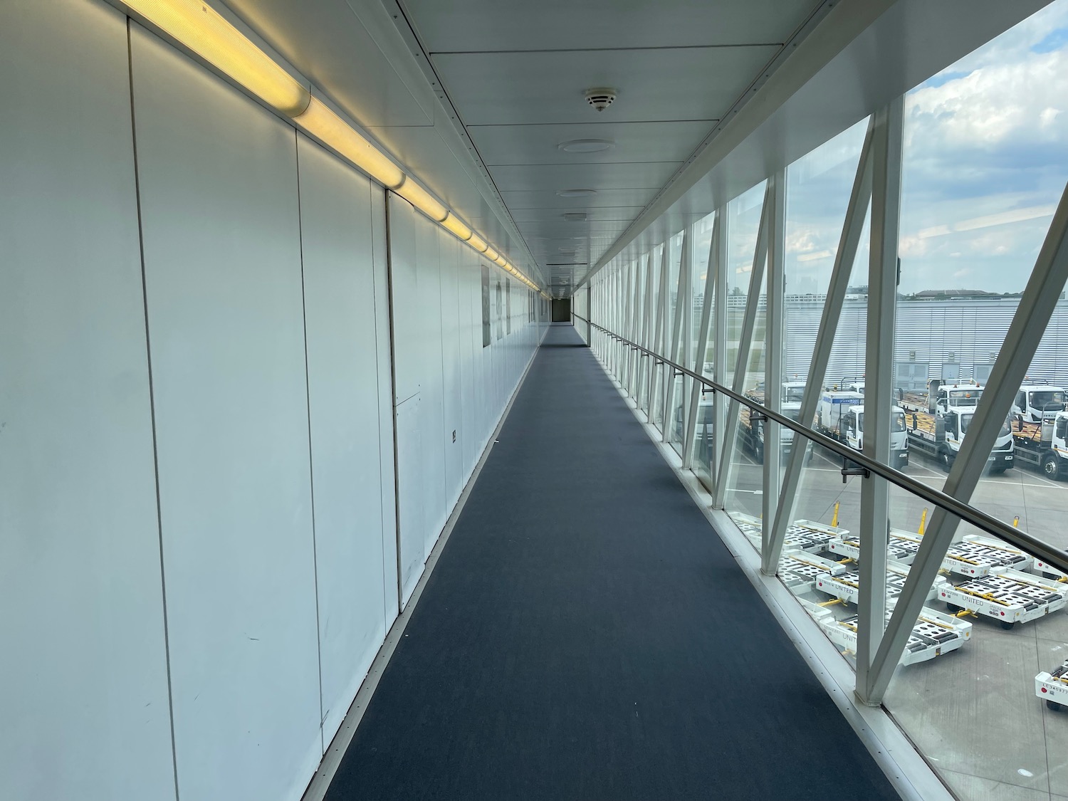 a long hallway with glass walls