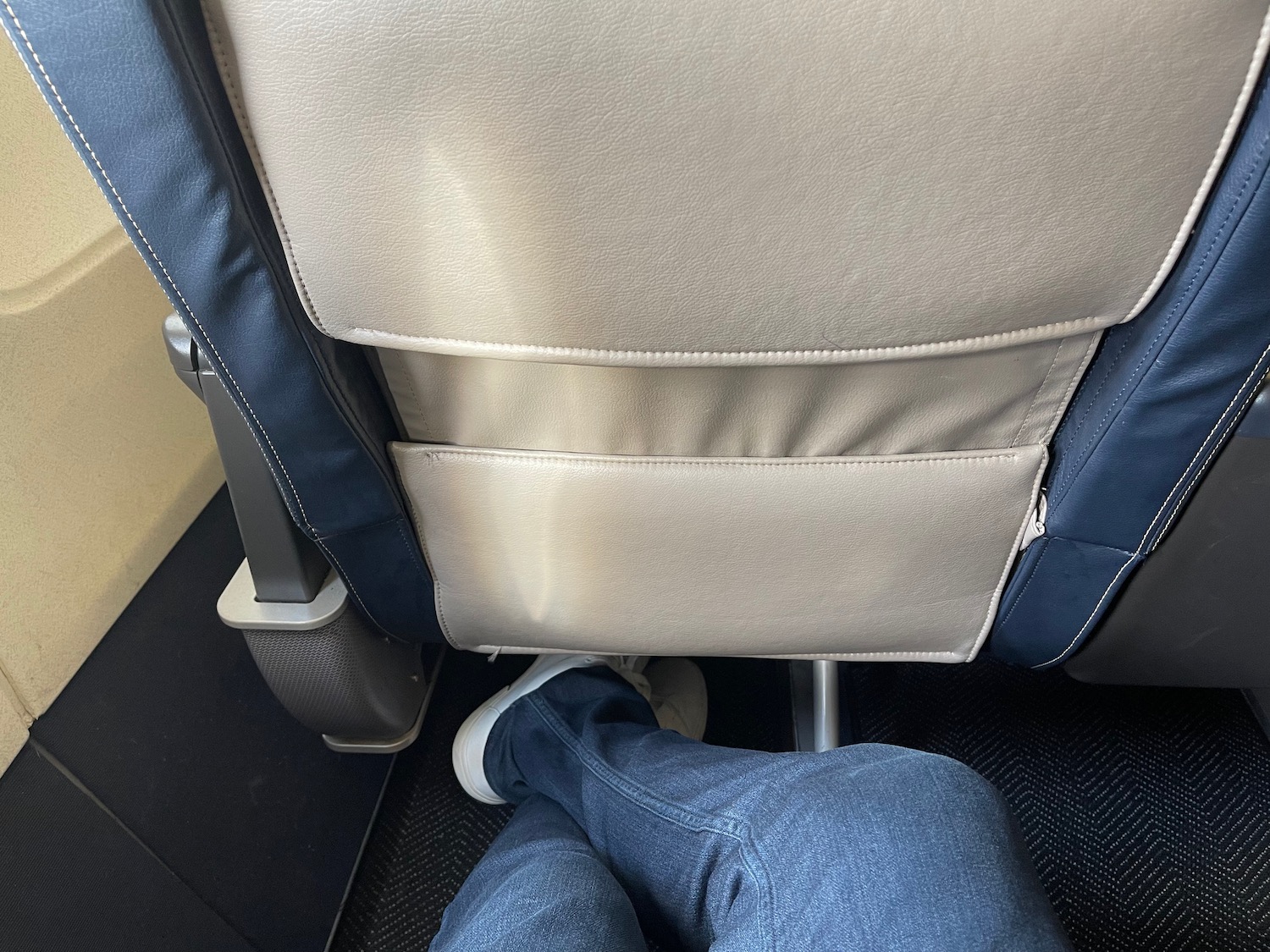 a person's legs in a seat