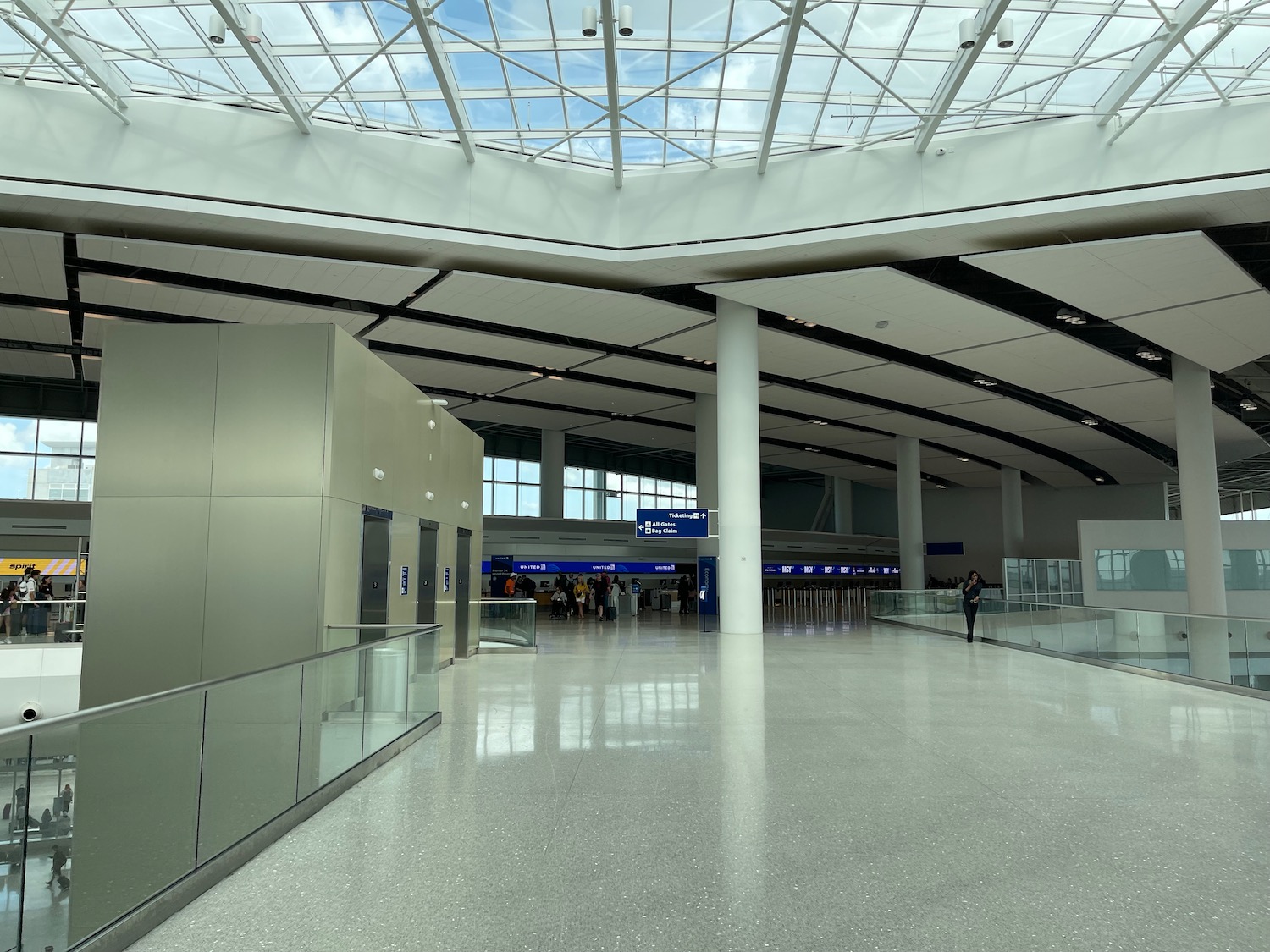 a large airport terminal with a glass roof