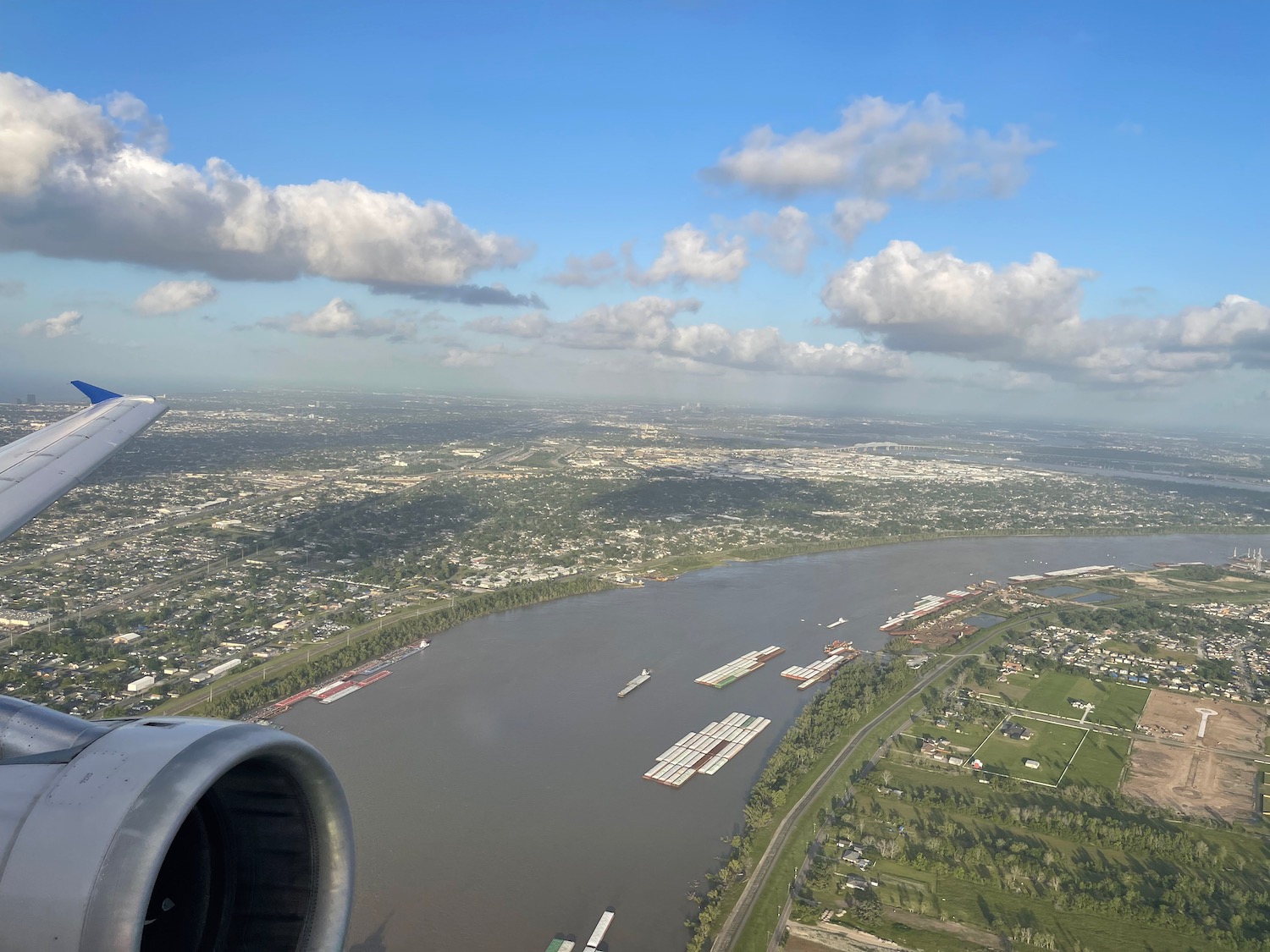 a view of a river and a city from an airplane