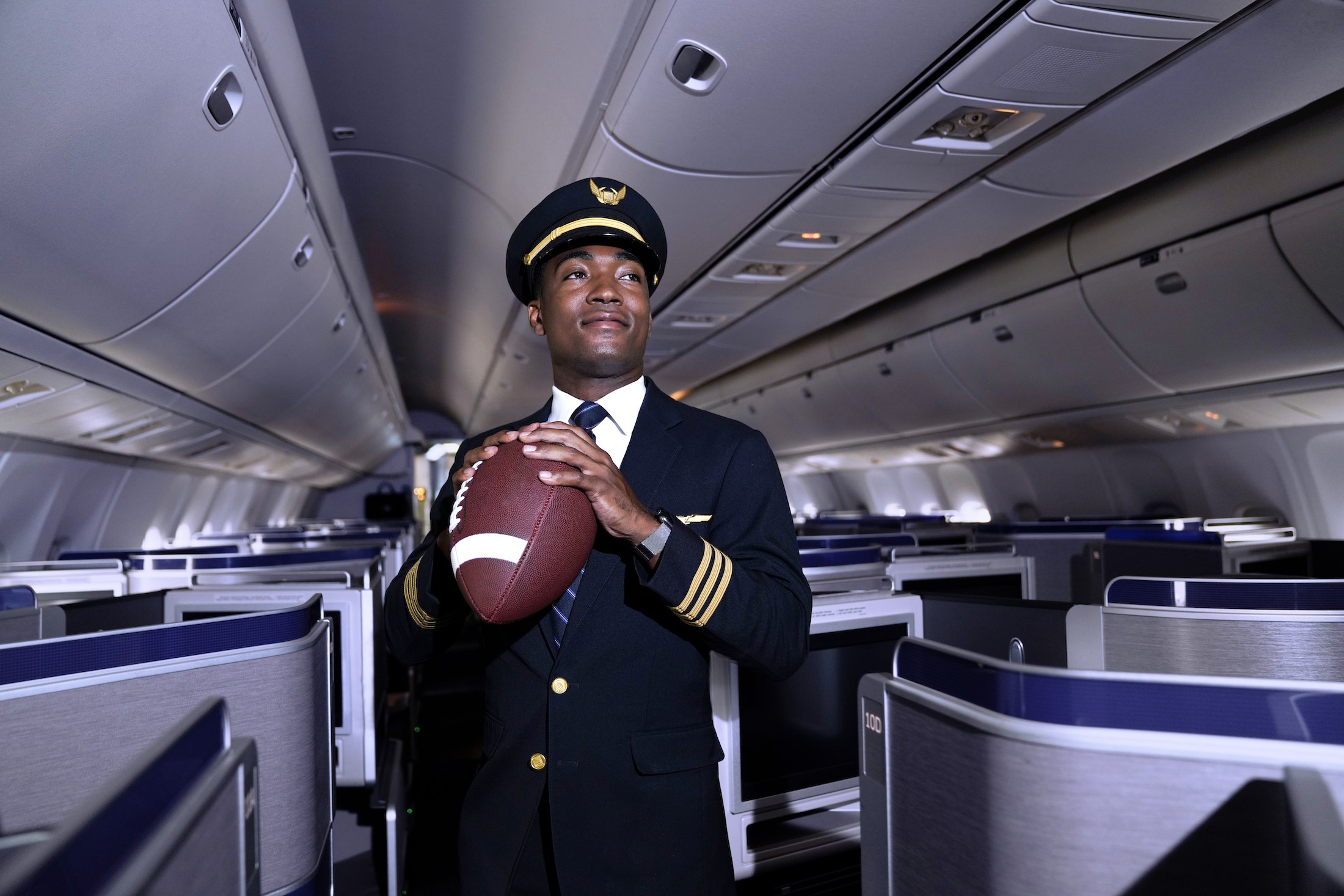 a man in uniform holding a football