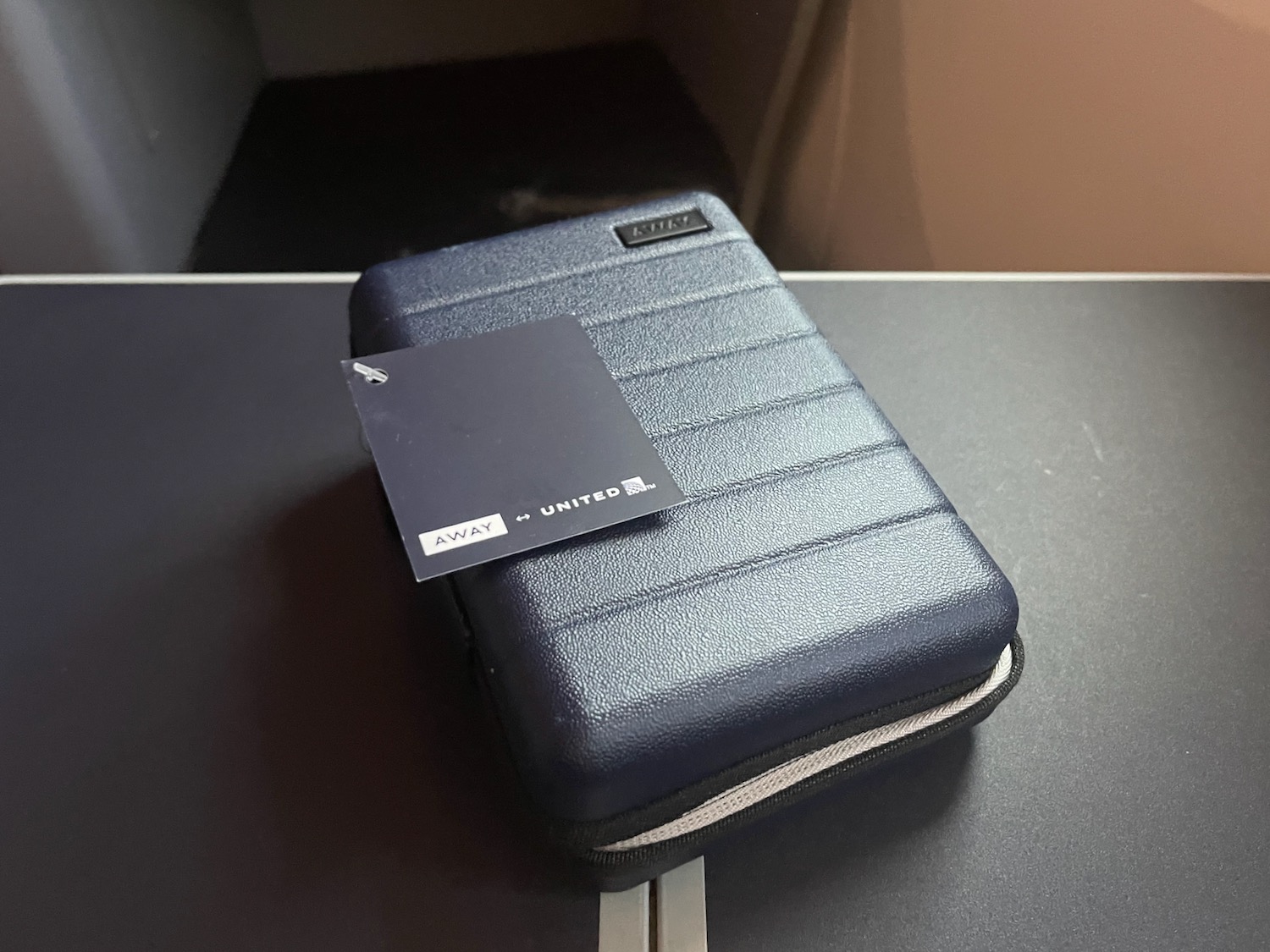 a blue case with a tag on it