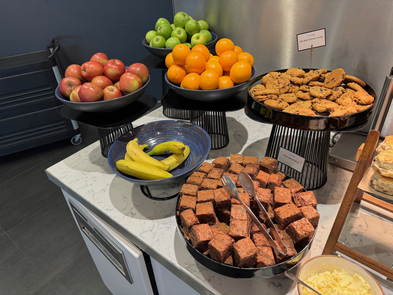 a group of bowls of food on a counter