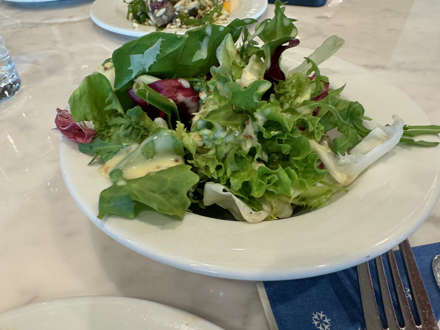 a plate of salad on a table