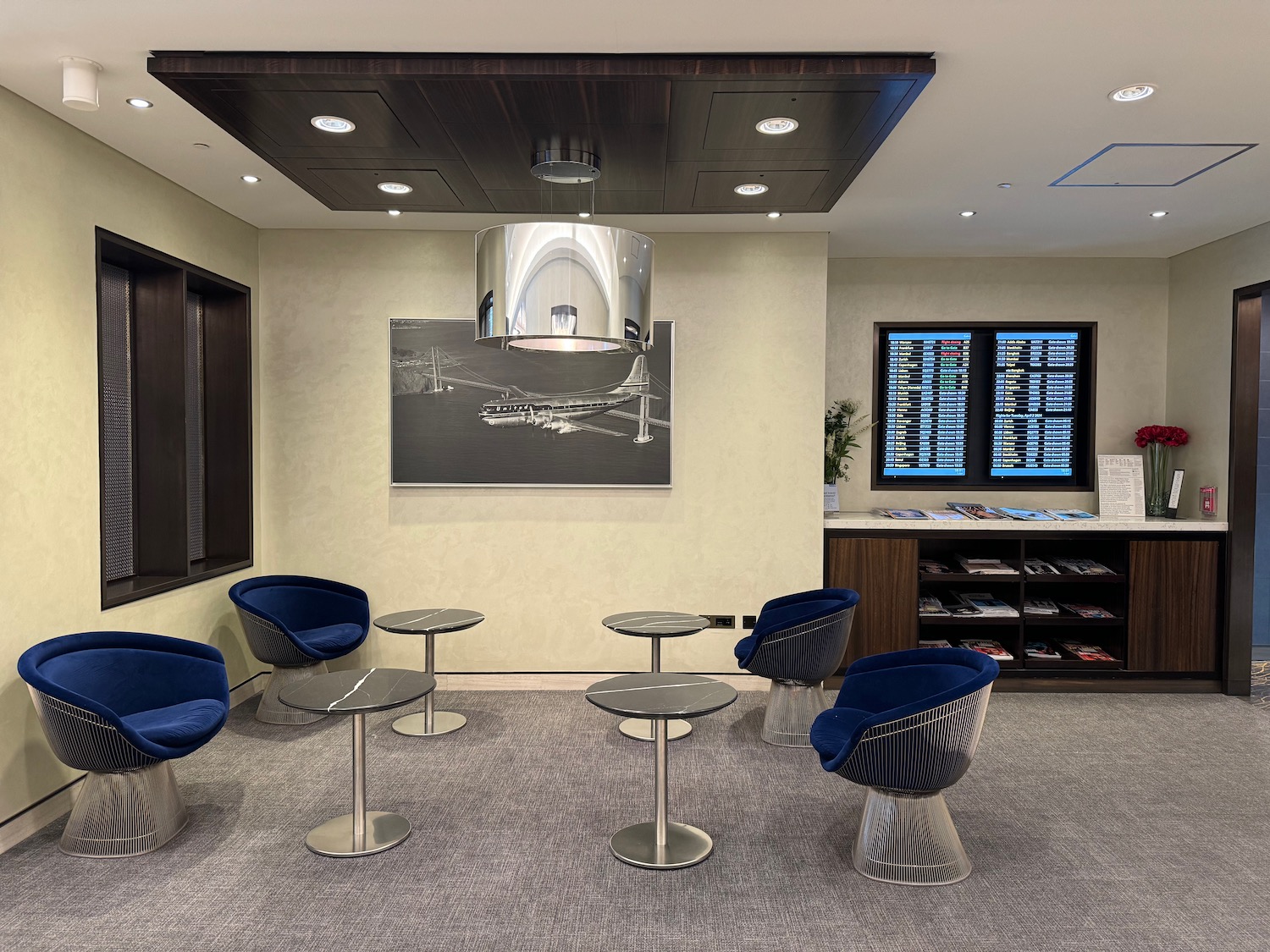 a room with blue chairs and tables