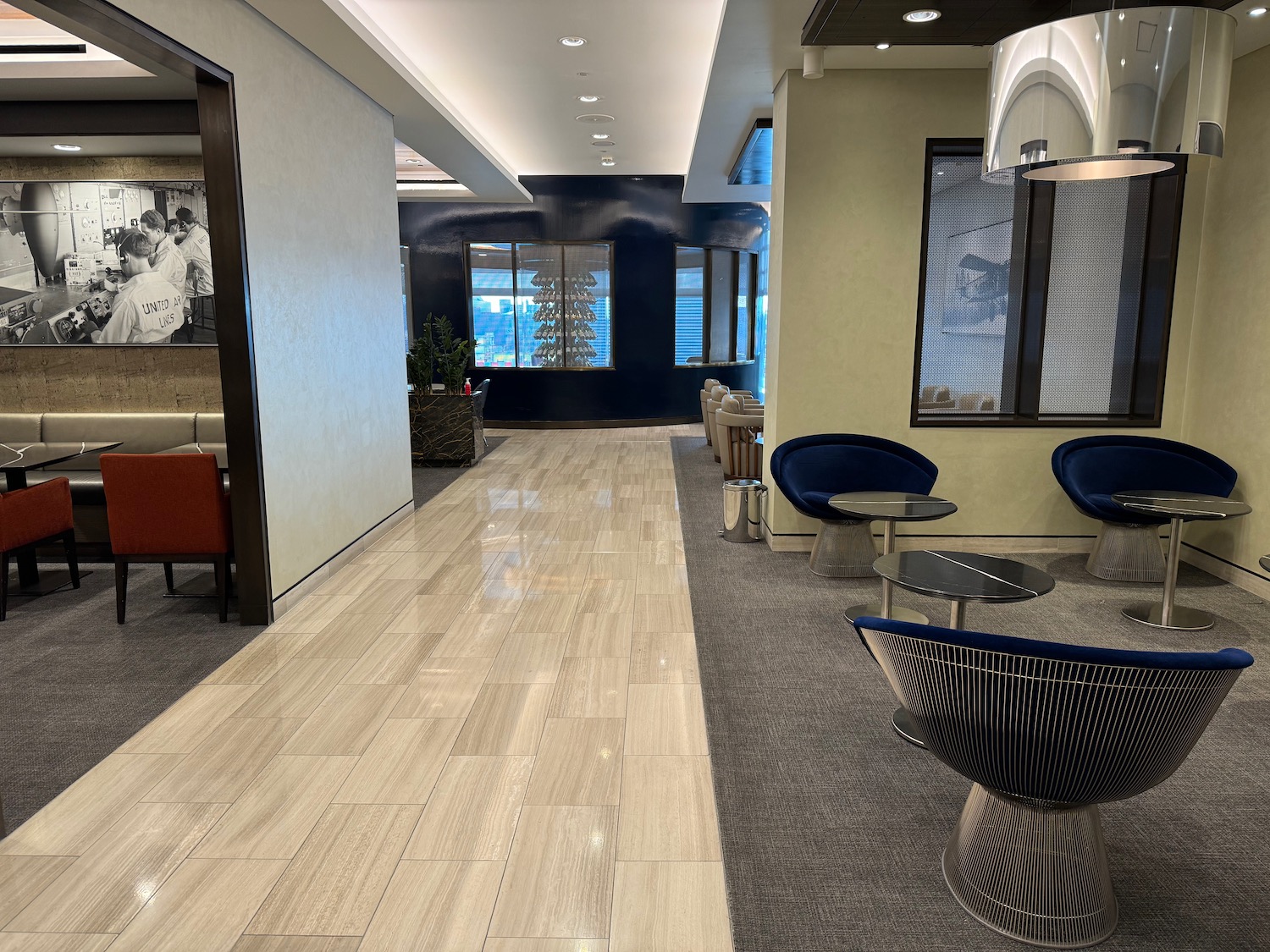 a hallway with chairs and tables