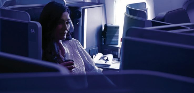 a woman sitting in an airplane