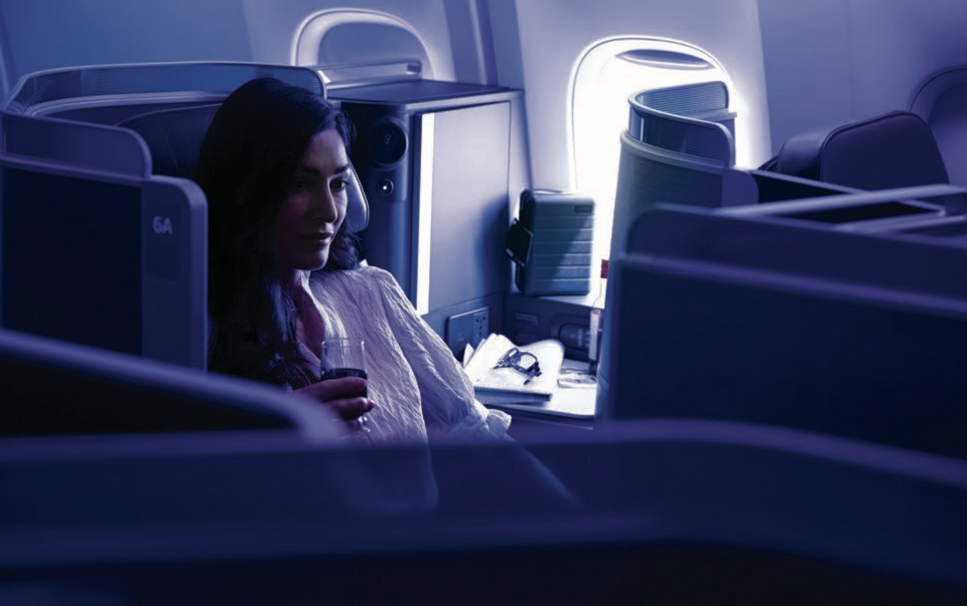 a woman sitting in an airplane