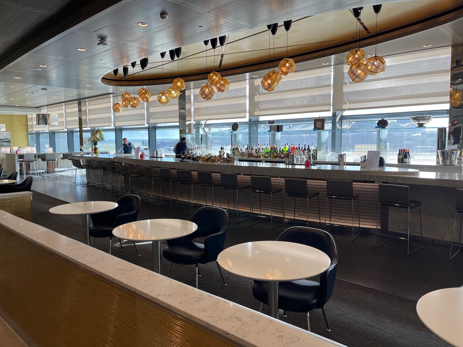 a bar with tables and chairs