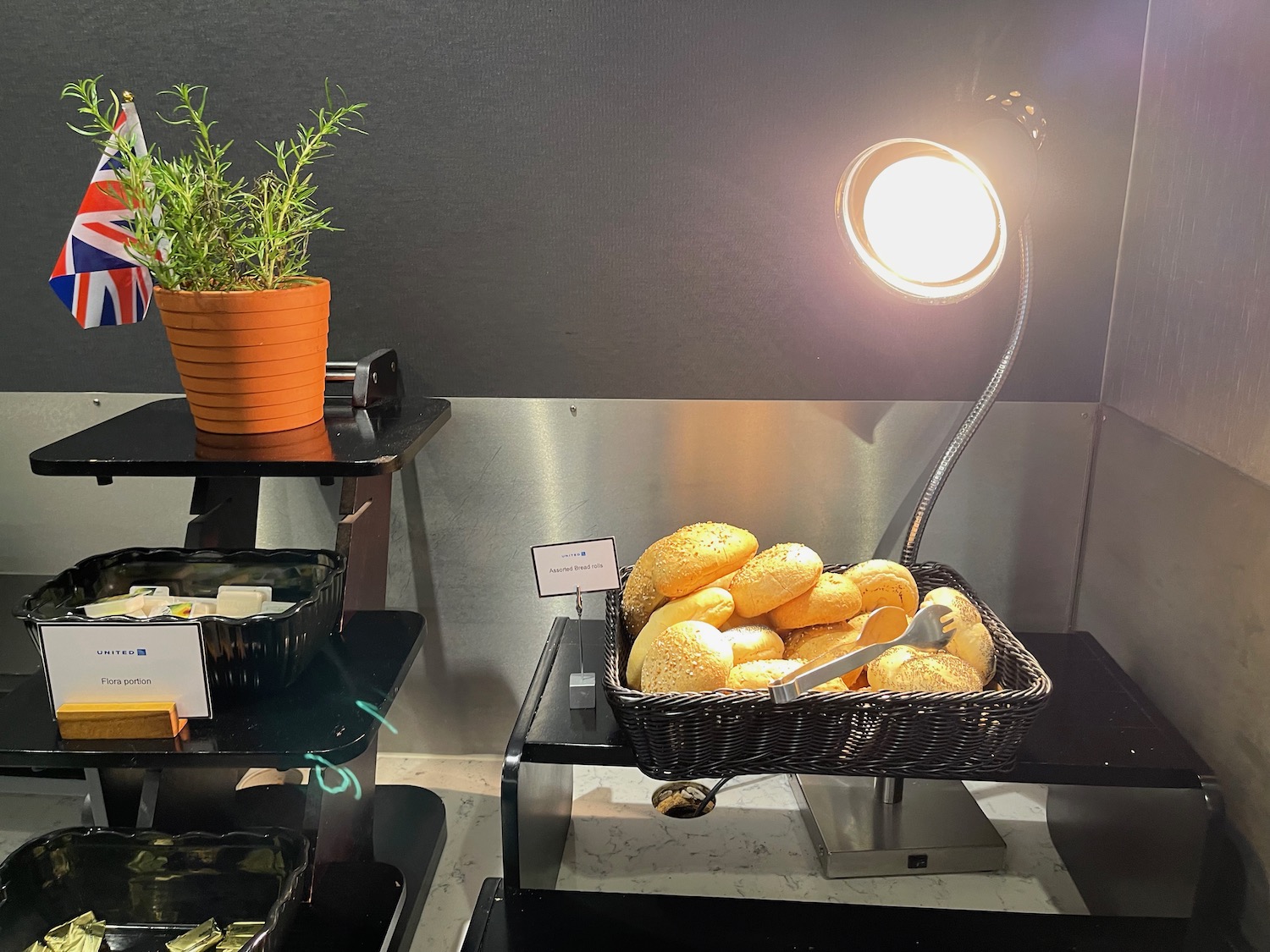 a basket of bread on a shelf with a light