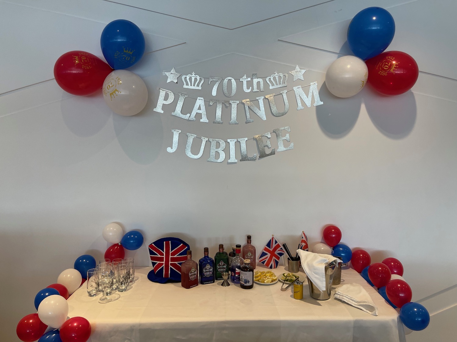 a table with balloons and drinks