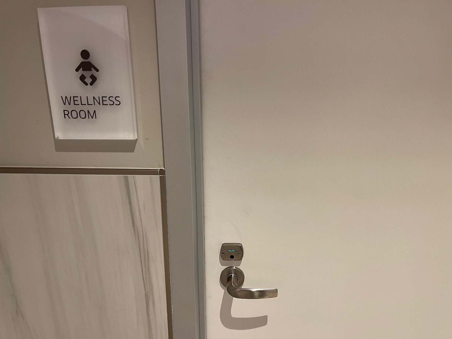 a door with a sign and a handle
