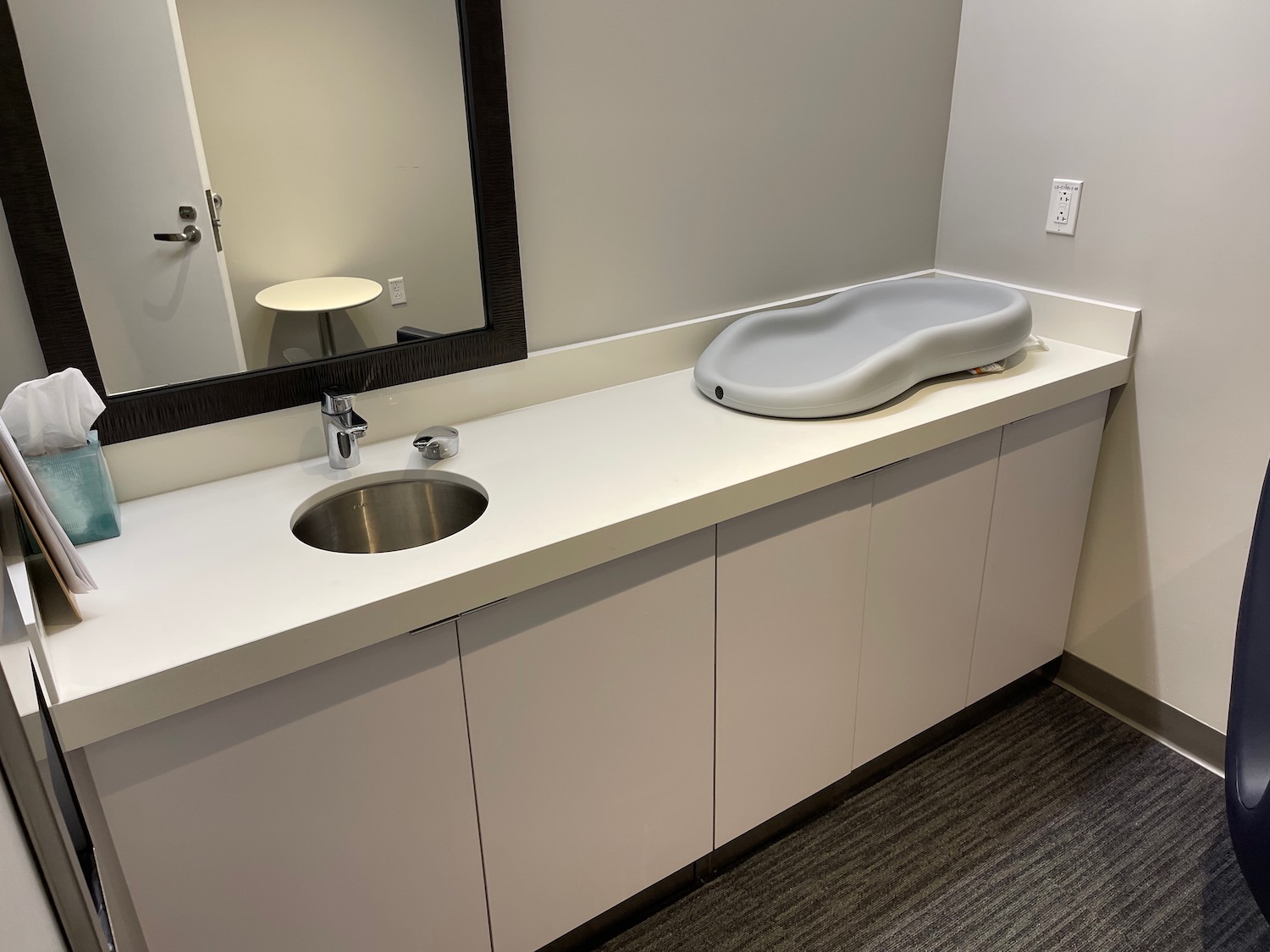 a sink and mirror in a room