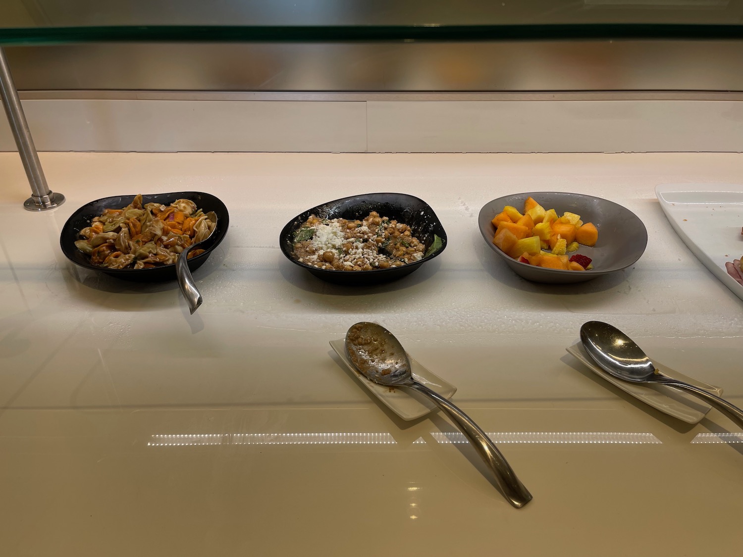 a row of bowls of food