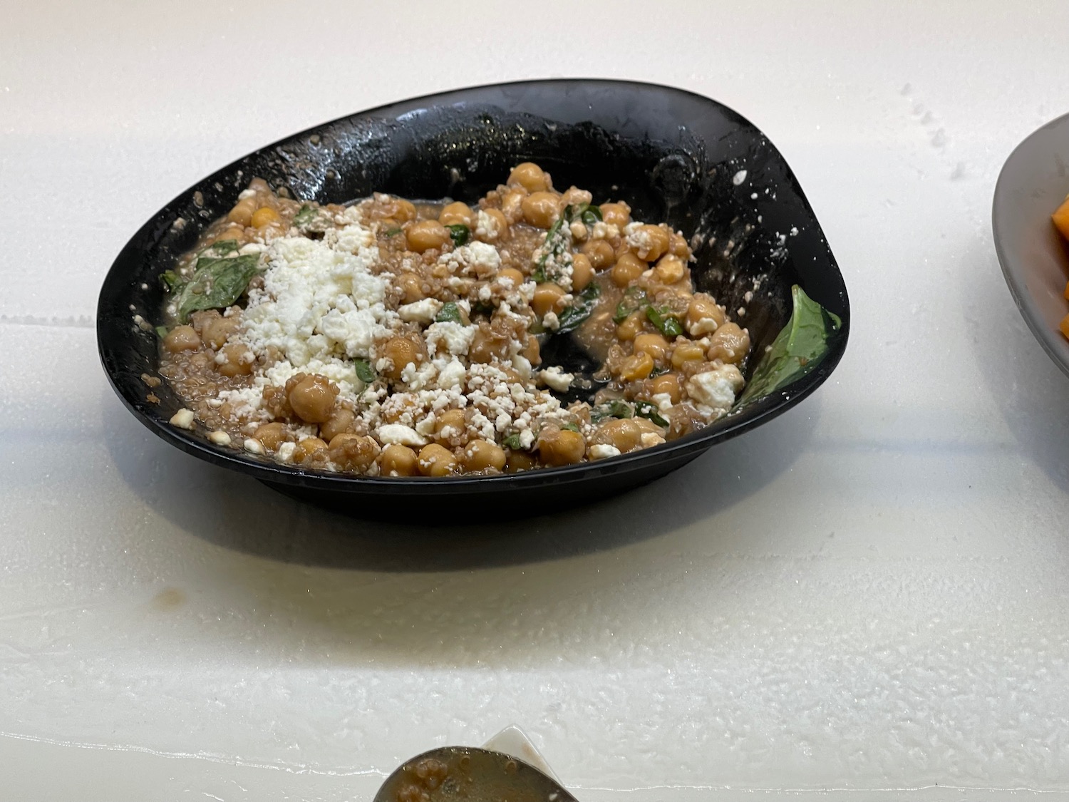 a bowl of food on a white surface