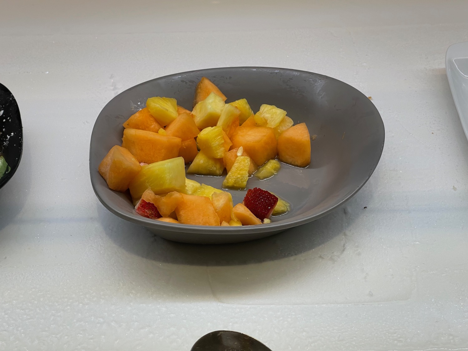 a bowl of fruit on a counter