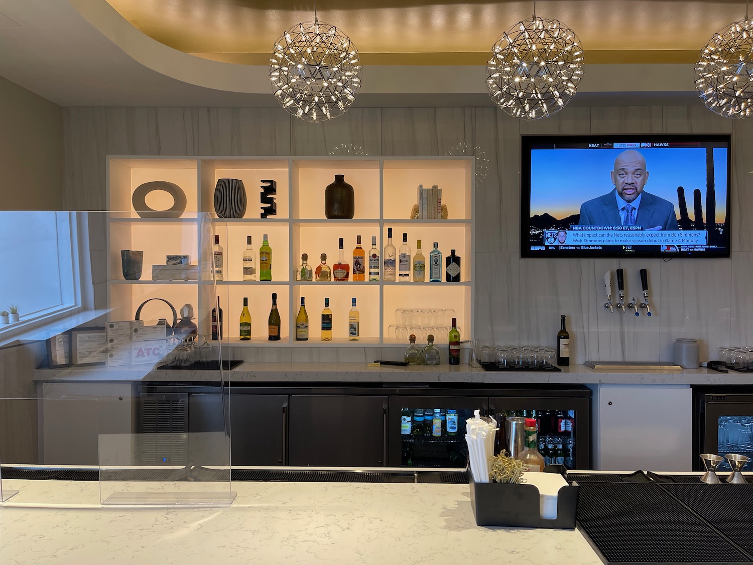 a bar with a television and shelves