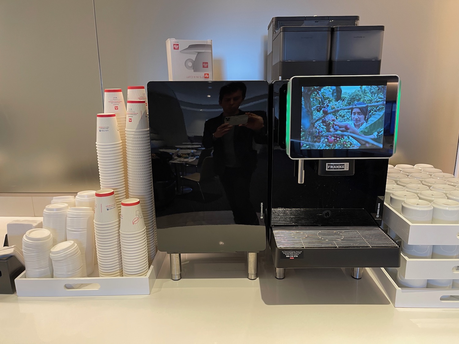 a machine and cups on a table