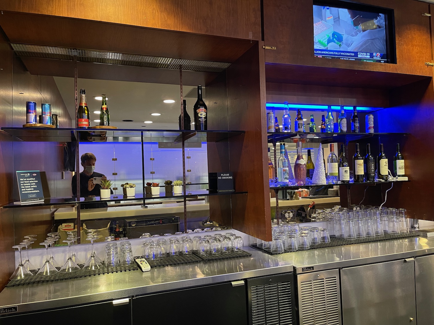 a bar with bottles and glasses