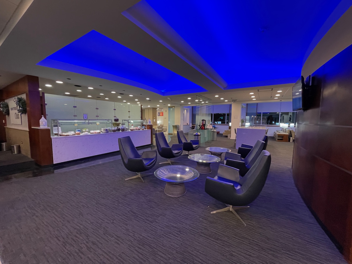 a room with a blue ceiling and a table and chairs