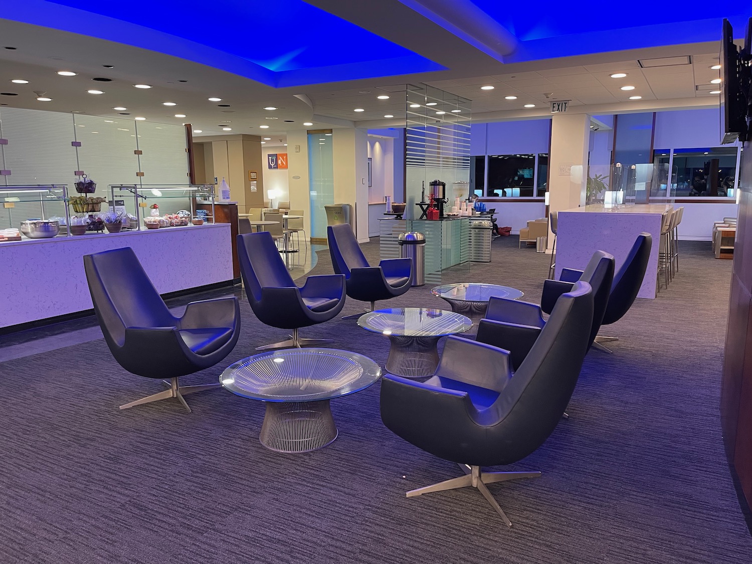 a group of chairs and tables in a room