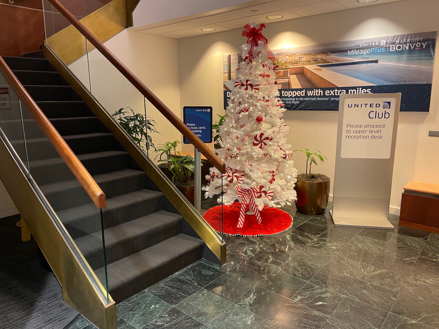 a white christmas tree in a lobby