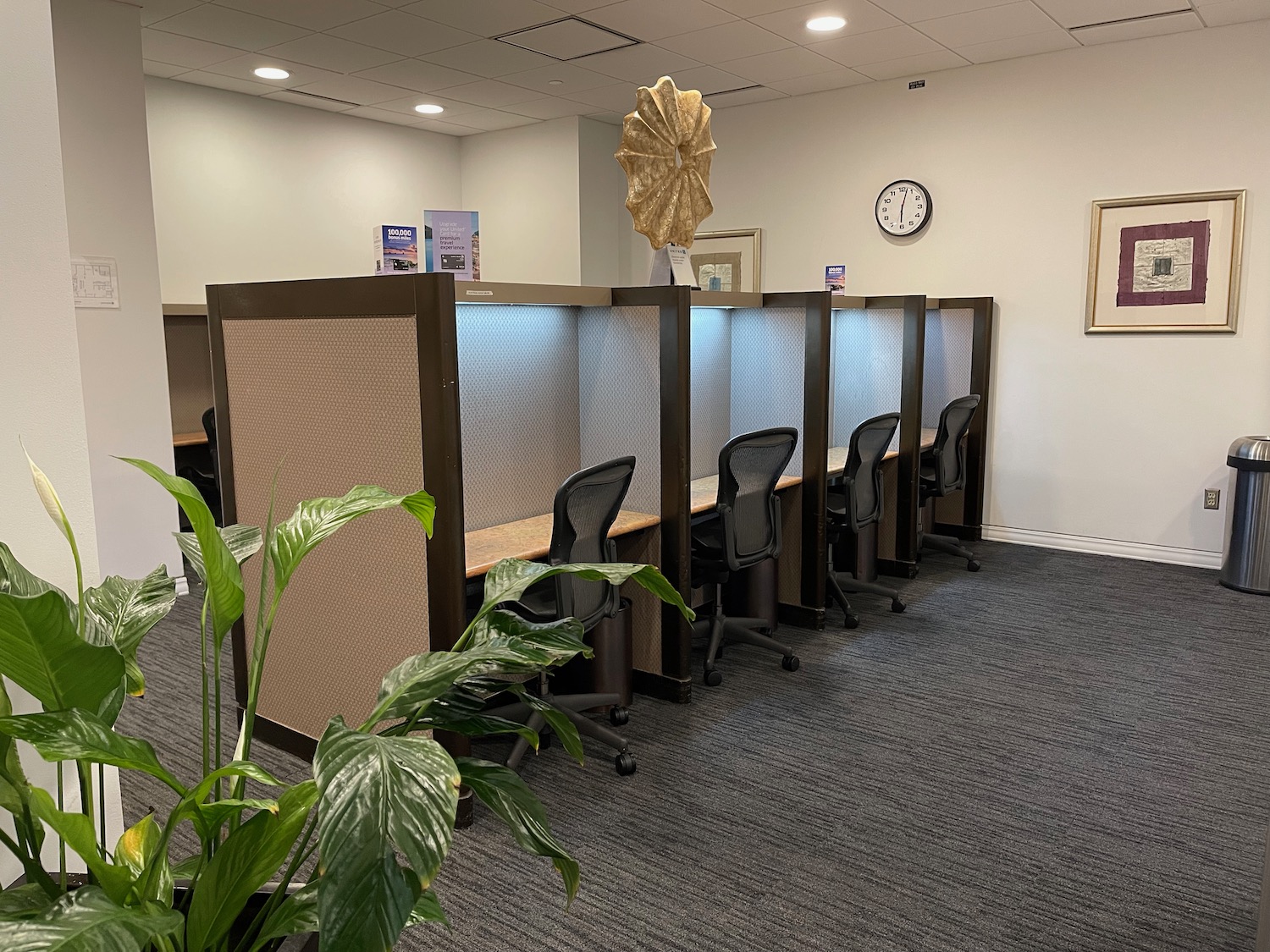 a room with cubicles and chairs