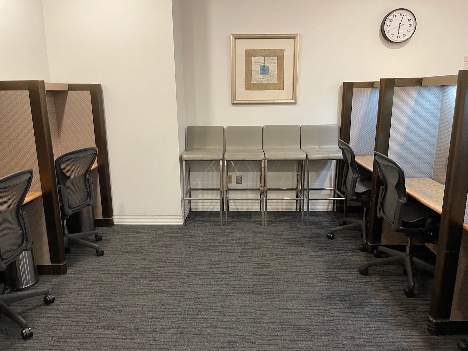 chairs in a room with chairs and a clock