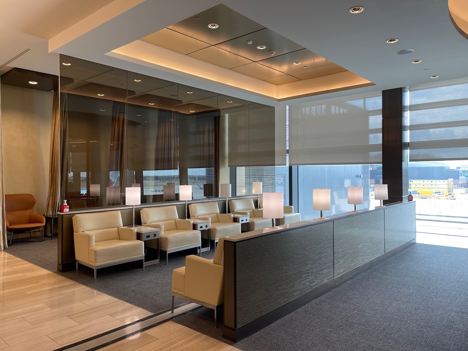 a room with a reception desk and chairs