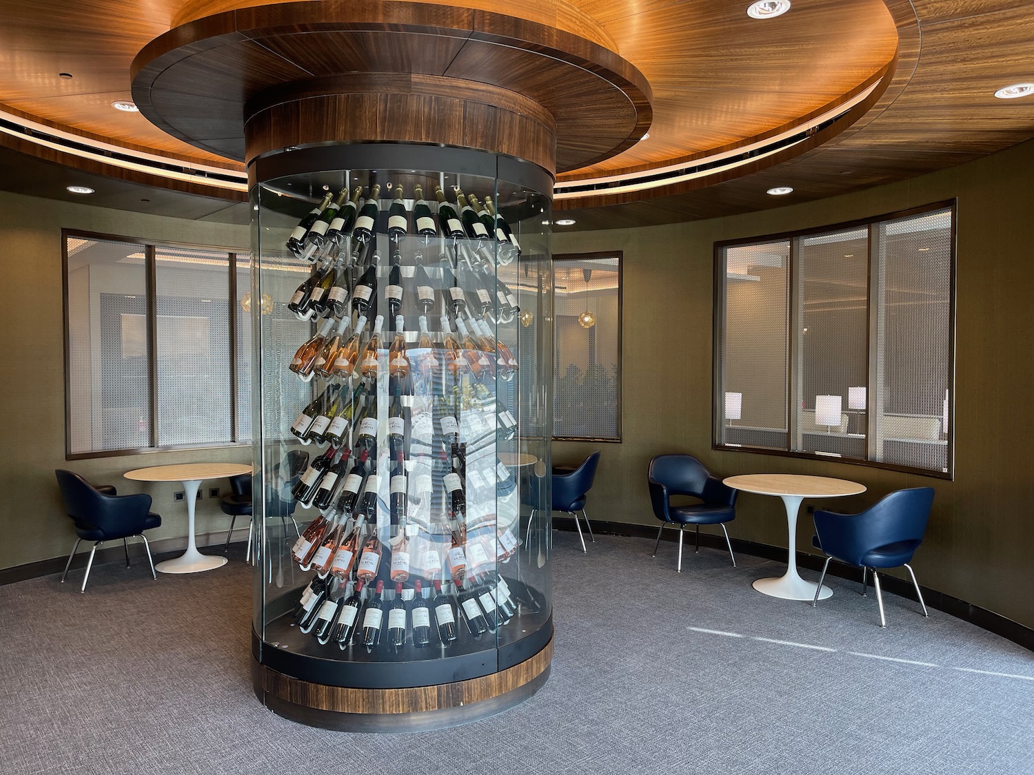 a glass display case with bottles of wine