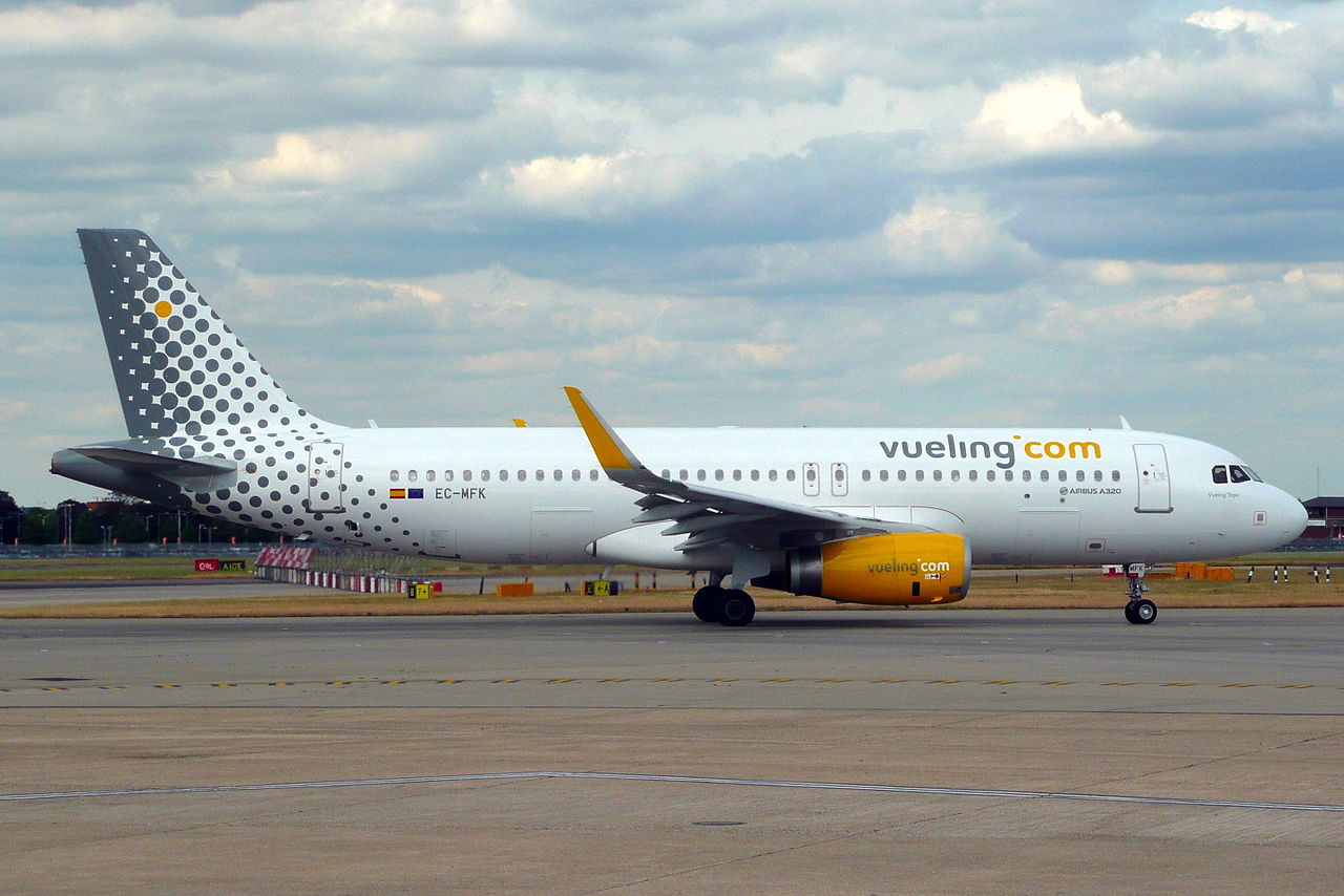 a white airplane on a runway