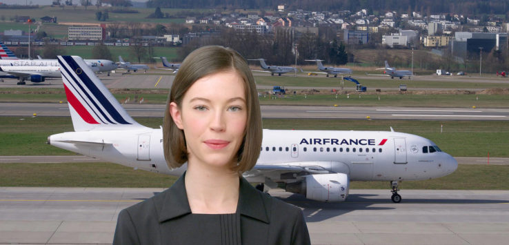 a woman standing in front of an airplane