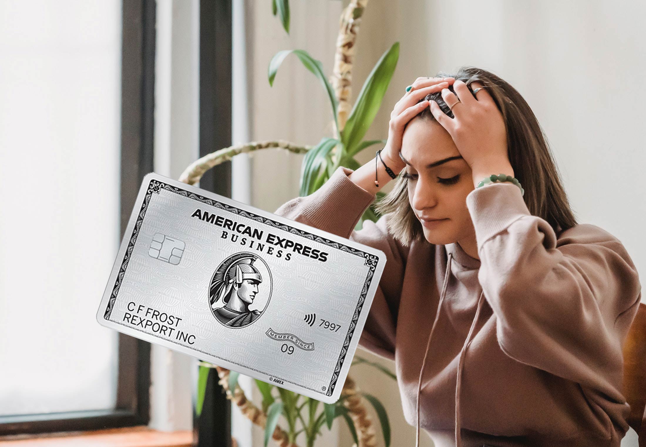 a woman holding her head and a credit card
